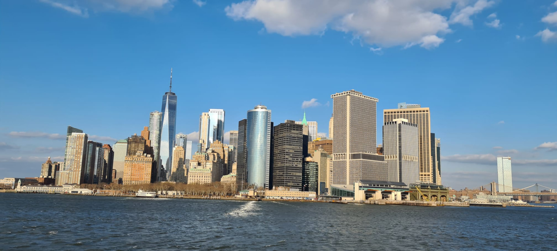 The Lower Manhattan skyline seen from the water on a clear day in New York